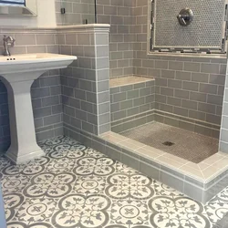 Bathtub and shower without tray in one room design