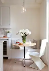 Photo Of A Kitchen With A Round Table Against The Wall