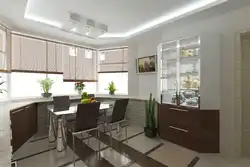 Interiors of a living room with a kitchen by the window