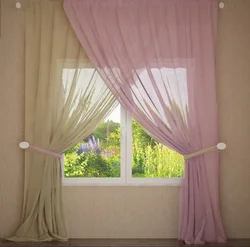 One Curtain On The Window In The Bedroom With Tulle Photo