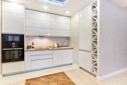 Photo of a corner kitchen with cabinets on only one wall