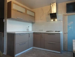 Photo of a corner kitchen with cabinets on only one wall