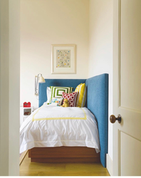 Bed along the wall in a small bedroom design