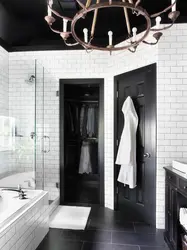 Bathroom design with dark door