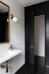 Bathroom design with dark door