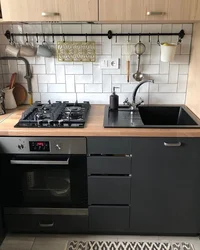 Sink and stove in the kitchen photo