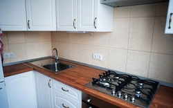 Sink and stove in the kitchen photo