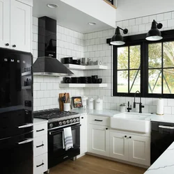 Black refrigerator in the interior of a white kitchen