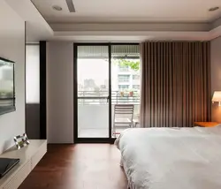 Bedroom design with balcony door and window