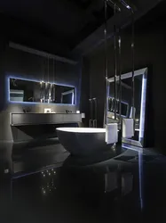 Black bathtub in the bathroom interior photo