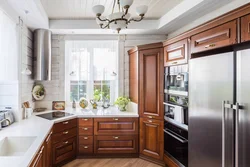 Kitchen interior in a house with window and door