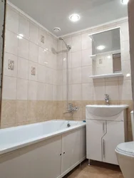 Photo Of A Bathtub After Renovation With Tiles In An Apartment