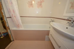 Photo of a bathtub after renovation with tiles in an apartment