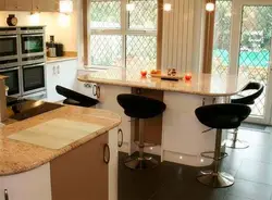 Window sill as a bar counter in the kitchen photo