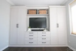 Wall cabinet with TV in the bedroom photo