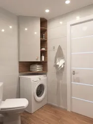 Cabinet above the washing machine in the bathroom photo in the interior