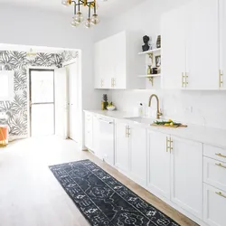 White kitchen with gold handles photo