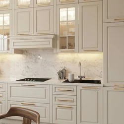 White kitchen with gold handles photo