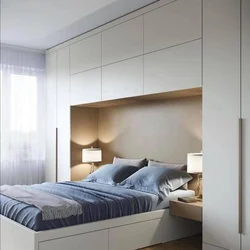 Built-in wardrobes in a bedroom with a bed photo design