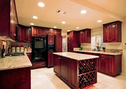 Cherry-colored kitchen in the interior photo