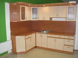 Cherry-colored kitchen in the interior photo