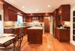 Cherry-Colored Kitchen In The Interior Photo