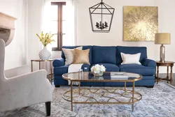 Beige living room interior with blue sofa