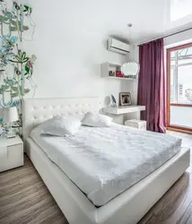 Small bedroom interior with white furniture