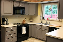 Small kitchen design with a window in the middle photo