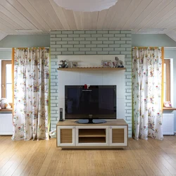 Interior of a living room in a country house made of clapboard