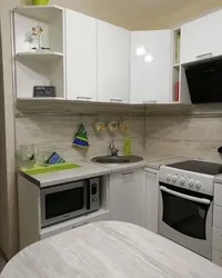 Built-in kitchen for a small corner kitchen with a refrigerator photo