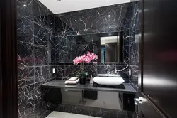 Bathroom design in black and white marble tiles