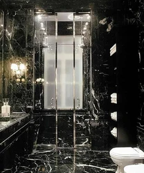 Bathroom design in black and white marble tiles