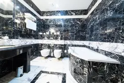 Bathroom design in black and white marble tiles