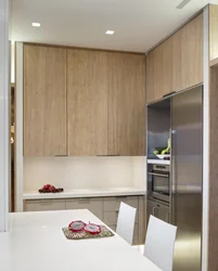 Small corner kitchen up to the ceiling photo