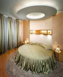 Round bed in the bedroom interior photo