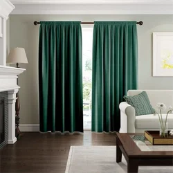 Emerald curtains in the bedroom interior