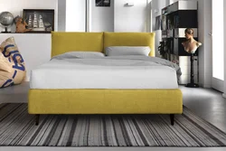 Yellow bed in the bedroom interior