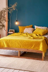 Yellow bed in the bedroom interior