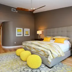 Yellow bed in the bedroom interior