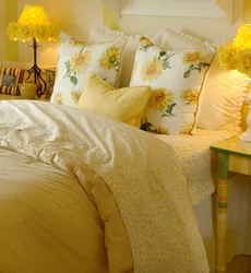 Yellow bed in the bedroom interior