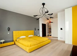 Yellow bed in the bedroom interior