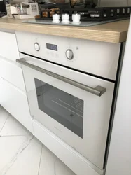 White Kitchen Black Oven Photo