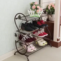 Shoe rack in the hallway made of metal photo