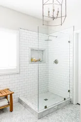 Photo Of Shower Enclosures In The Bathroom With A Tray