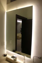Mirror with lighting in the hallway wall-mounted interior