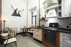 Kitchen interior with pipes on the wall