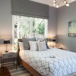 Bedroom interior with a window at the head