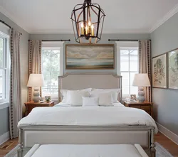 Bedroom interior with a window at the head