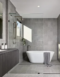 Bath design with gray tiles on the floor